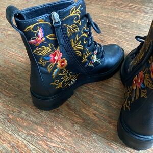 Johnny Waz black and floral combat boots.